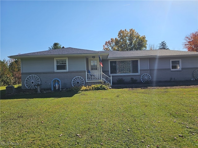 ranch-style home with a front yard