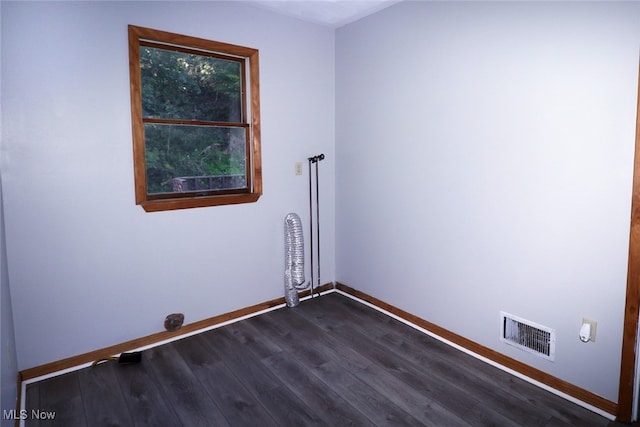 empty room featuring dark hardwood / wood-style floors