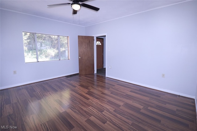 unfurnished room with ornamental molding, dark hardwood / wood-style floors, and ceiling fan