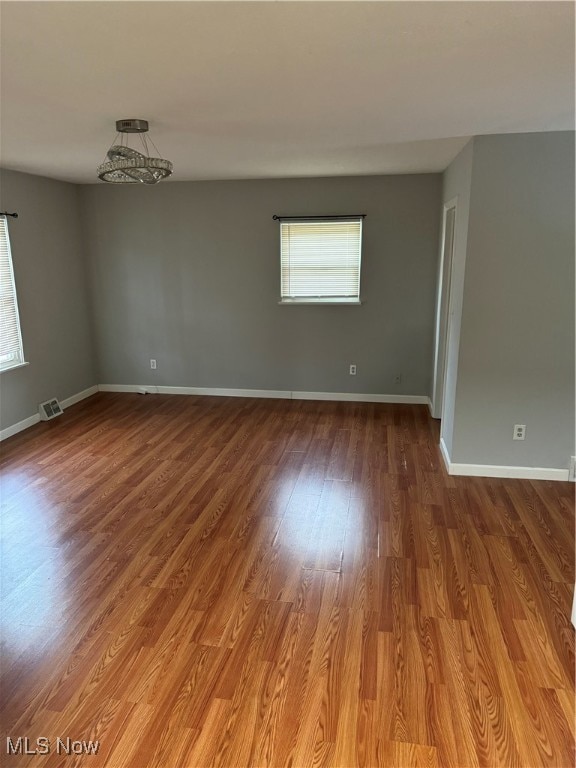 spare room with hardwood / wood-style flooring