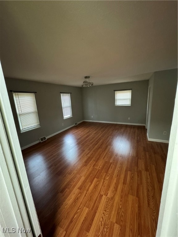 empty room featuring hardwood / wood-style flooring