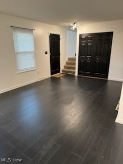 empty room featuring dark wood-type flooring