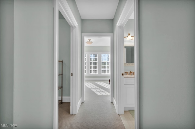 39470 Stillman Ln, Willoughby, OH 44094 - hallway featuring light colored carpet and sink