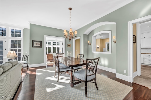 39470 Stillman Ln, Willoughby, OH 44094 - dining space with crown molding, a notable chandelier, and dark hardwood / wood-style flooring