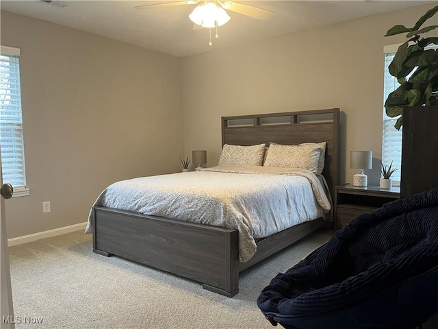 bedroom with ceiling fan and carpet floors