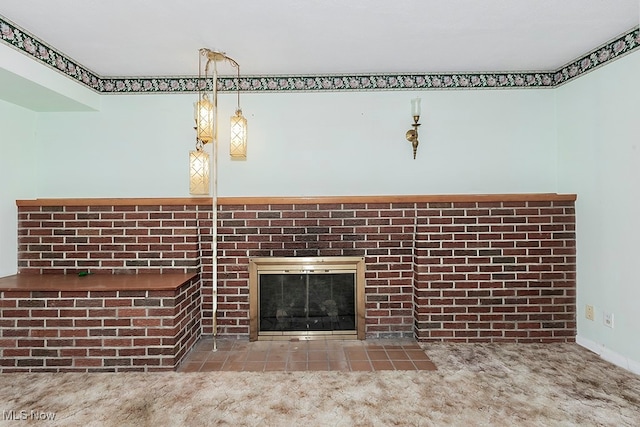 room details featuring carpet and a brick fireplace