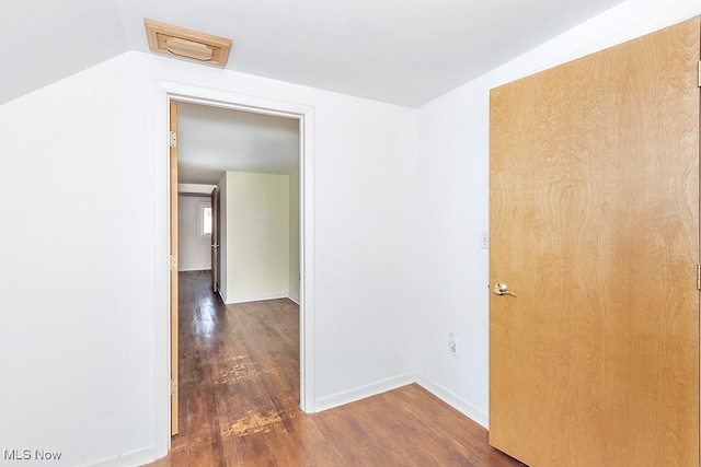 hallway featuring dark wood-type flooring