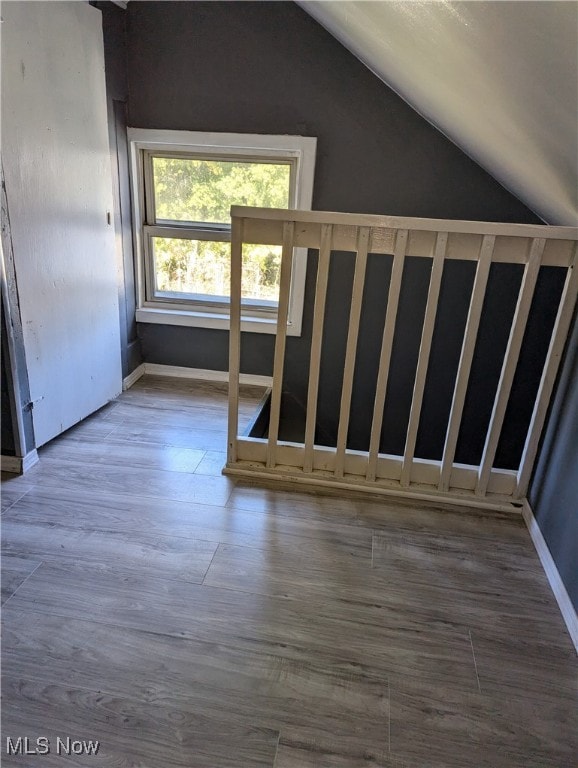 stairs with vaulted ceiling