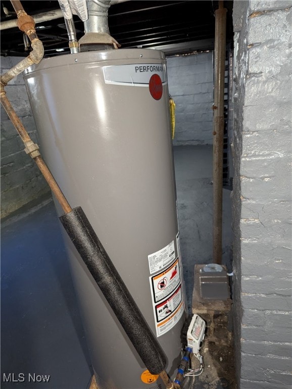 utility room with water heater