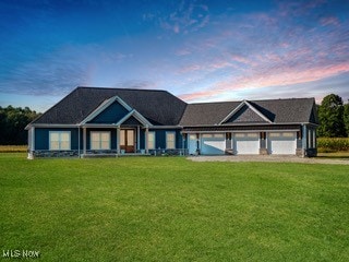 view of front of home featuring a lawn