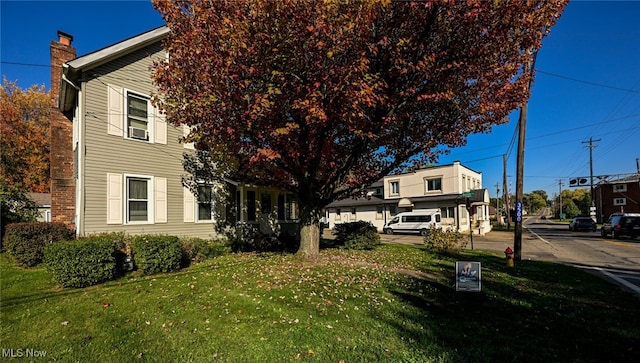 view of home's exterior with a yard