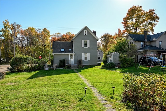 back of house with a yard