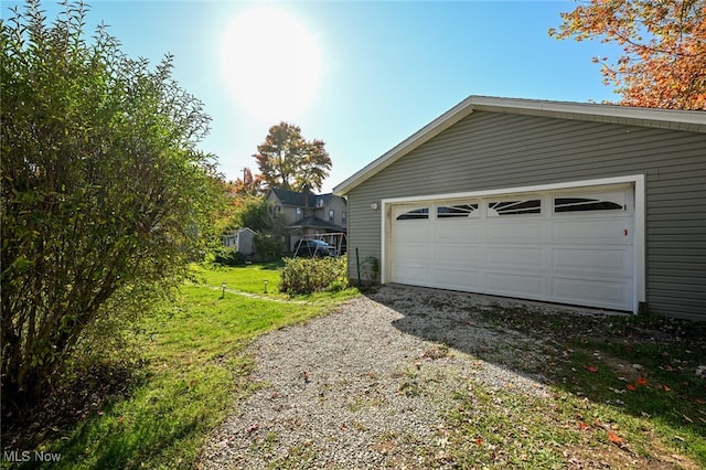 garage with a yard