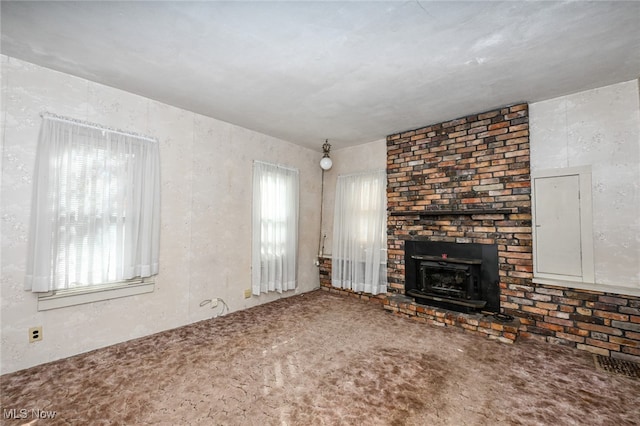 unfurnished living room featuring carpet flooring