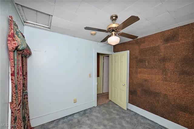 spare room with ceiling fan and carpet flooring