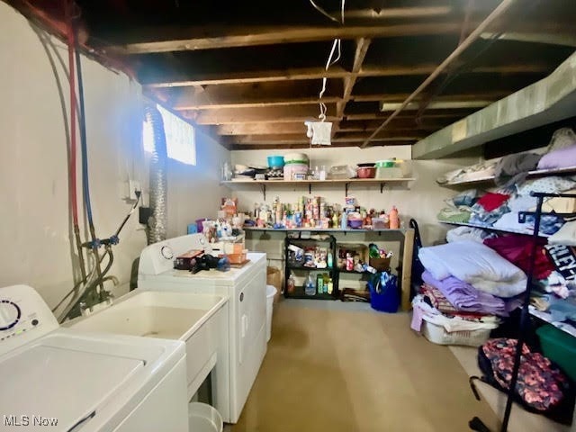 washroom with washing machine and dryer