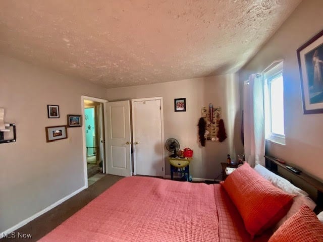 bedroom featuring a textured ceiling