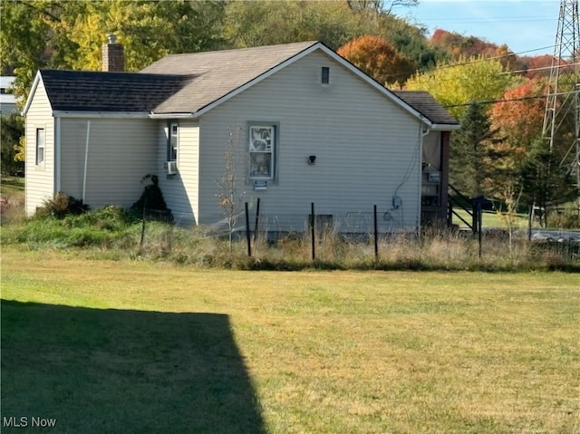 view of home's exterior featuring a lawn