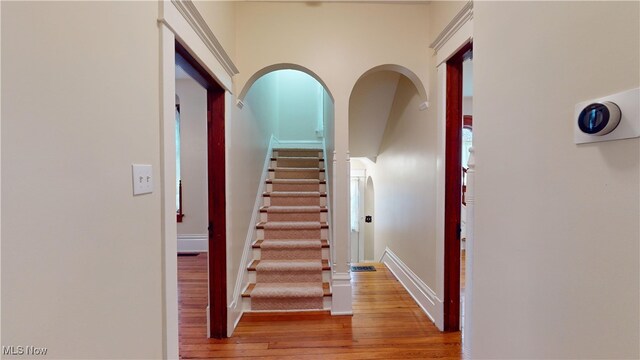 stairway featuring hardwood / wood-style floors