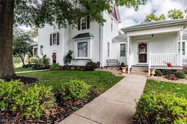 view of front of house featuring a front lawn and a porch