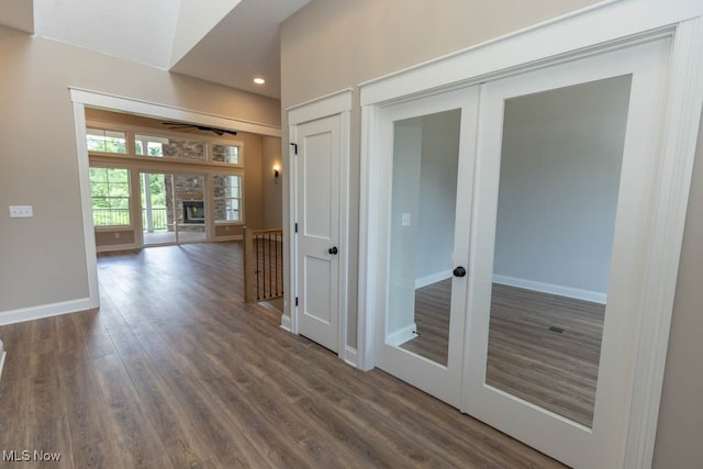 hall featuring dark hardwood / wood-style floors and french doors