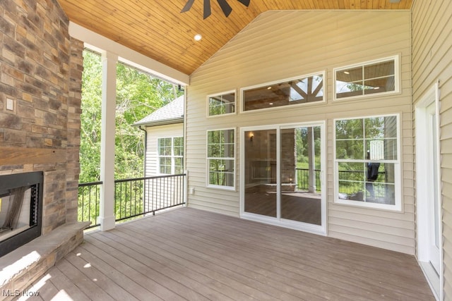 wooden terrace featuring ceiling fan