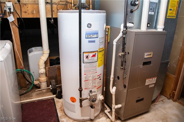 utility room with heating unit and water heater