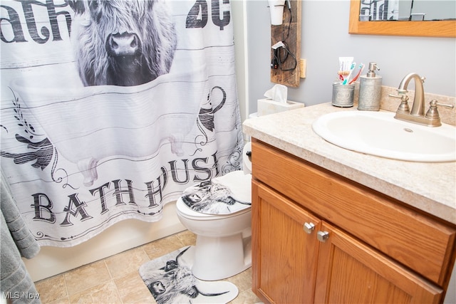 full bathroom featuring tile patterned flooring, vanity, toilet, and shower / bathtub combination with curtain