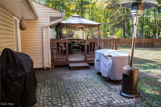 deck with a gazebo and area for grilling