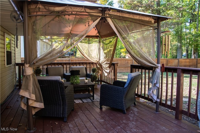 wooden deck featuring outdoor lounge area