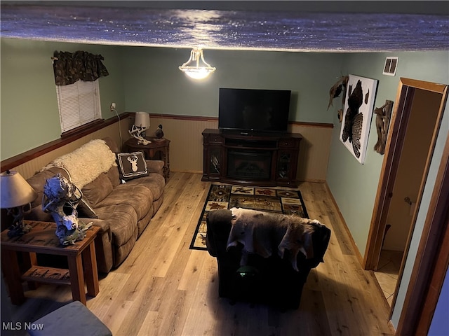 living room with light hardwood / wood-style flooring