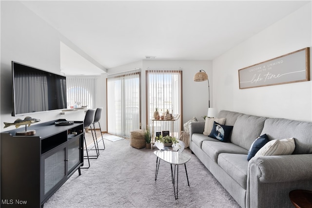 living room featuring light carpet