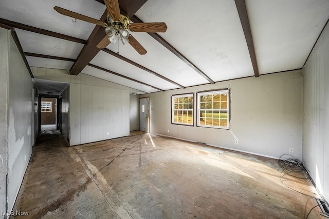 unfurnished room featuring vaulted ceiling with beams and ceiling fan