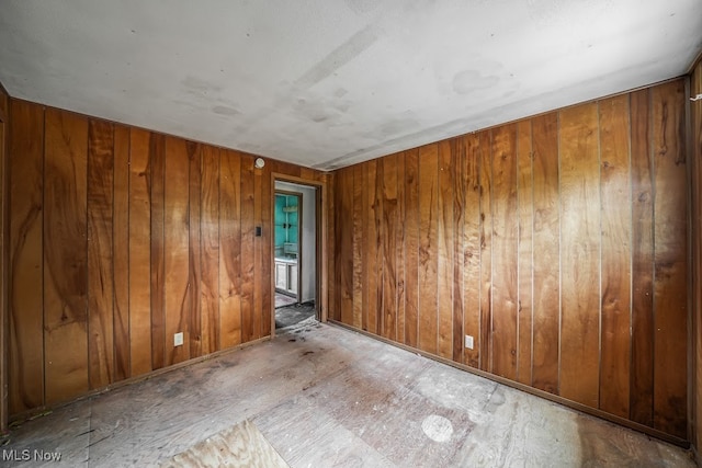 empty room with wooden walls