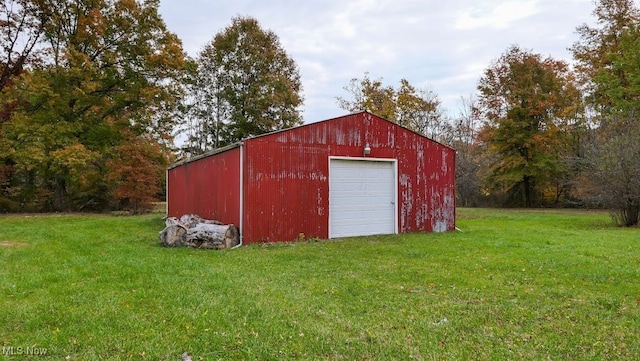 view of outbuilding featuring a yard and a garage