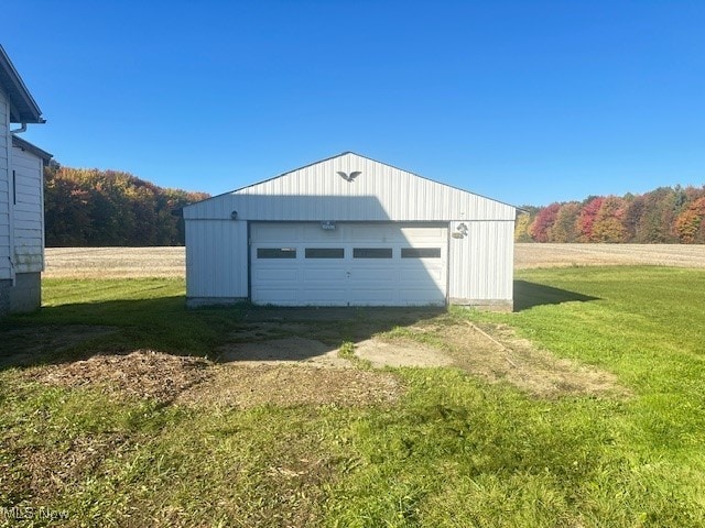 garage with a lawn