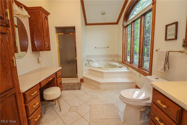 full bathroom with vanity, toilet, tile patterned floors, and shower with separate bathtub