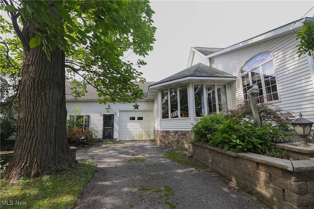 view of side of property featuring a garage