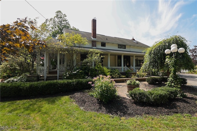 back of house with a porch