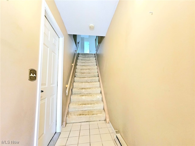 staircase with tile patterned flooring