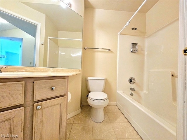 full bathroom with vanity, washtub / shower combination, toilet, and tile patterned floors