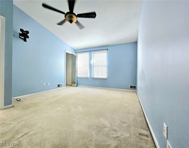 empty room featuring light carpet and ceiling fan