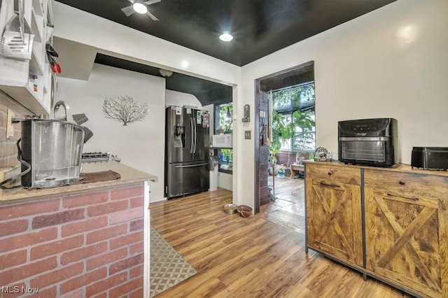 kitchen featuring stainless steel fridge and light wood-type flooring