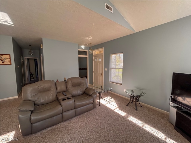 living room with light carpet and a textured ceiling