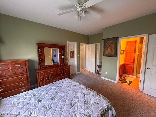 carpeted bedroom with ceiling fan and ensuite bath