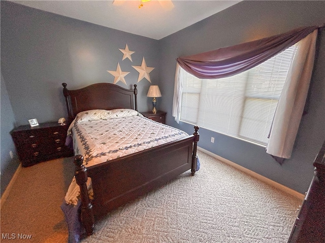 carpeted bedroom with ceiling fan