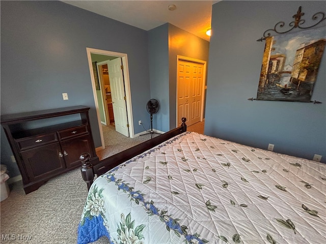 carpeted bedroom with ensuite bath