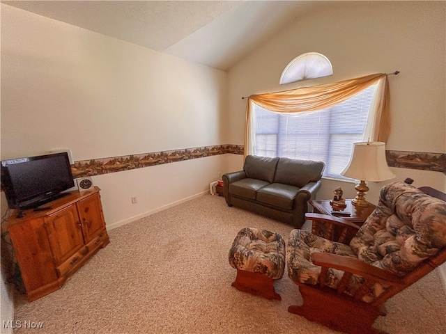 carpeted living room with vaulted ceiling