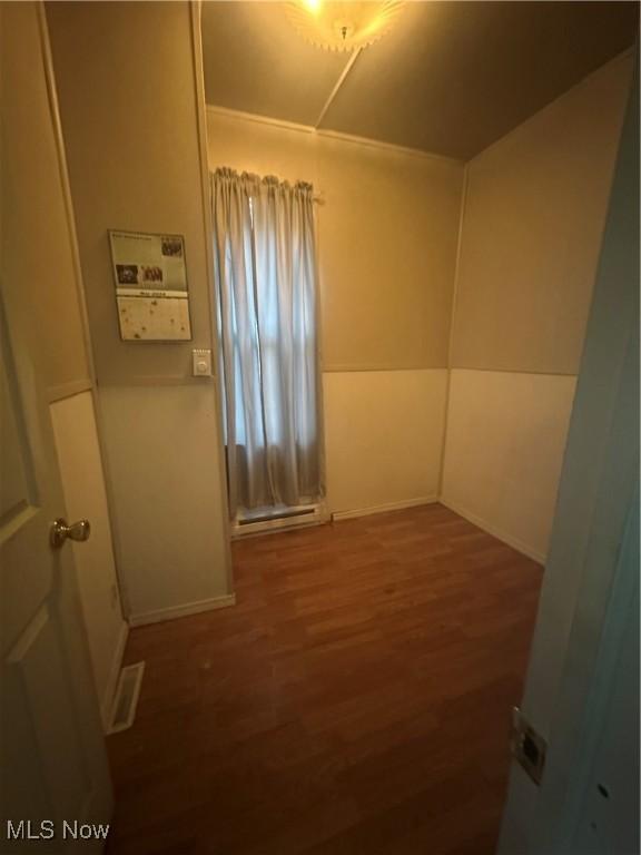 unfurnished room featuring dark hardwood / wood-style floors