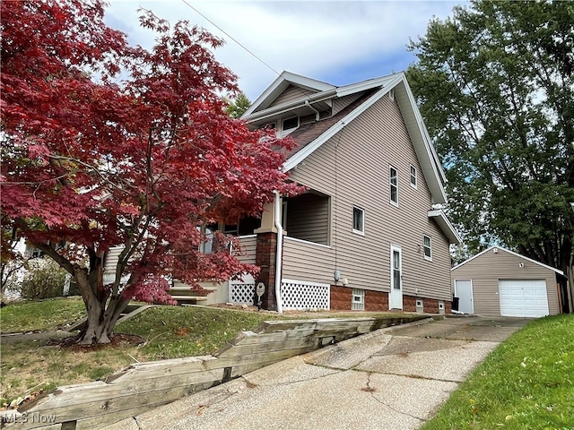 view of side of home with an outbuilding and a garage